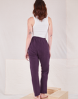 Back view of Rolled Cuff Sweat Pants in Nebula Purple and Cropped Tank in vintage tee off-white on Alex