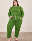 Marielena is wearing Heavyweight Crew in Lawn Green and matching Cropped Rolled Cuff Sweatpants