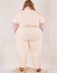 Back view of Heritage Short Sleeve Jumpsuit in Natural worn by Catie