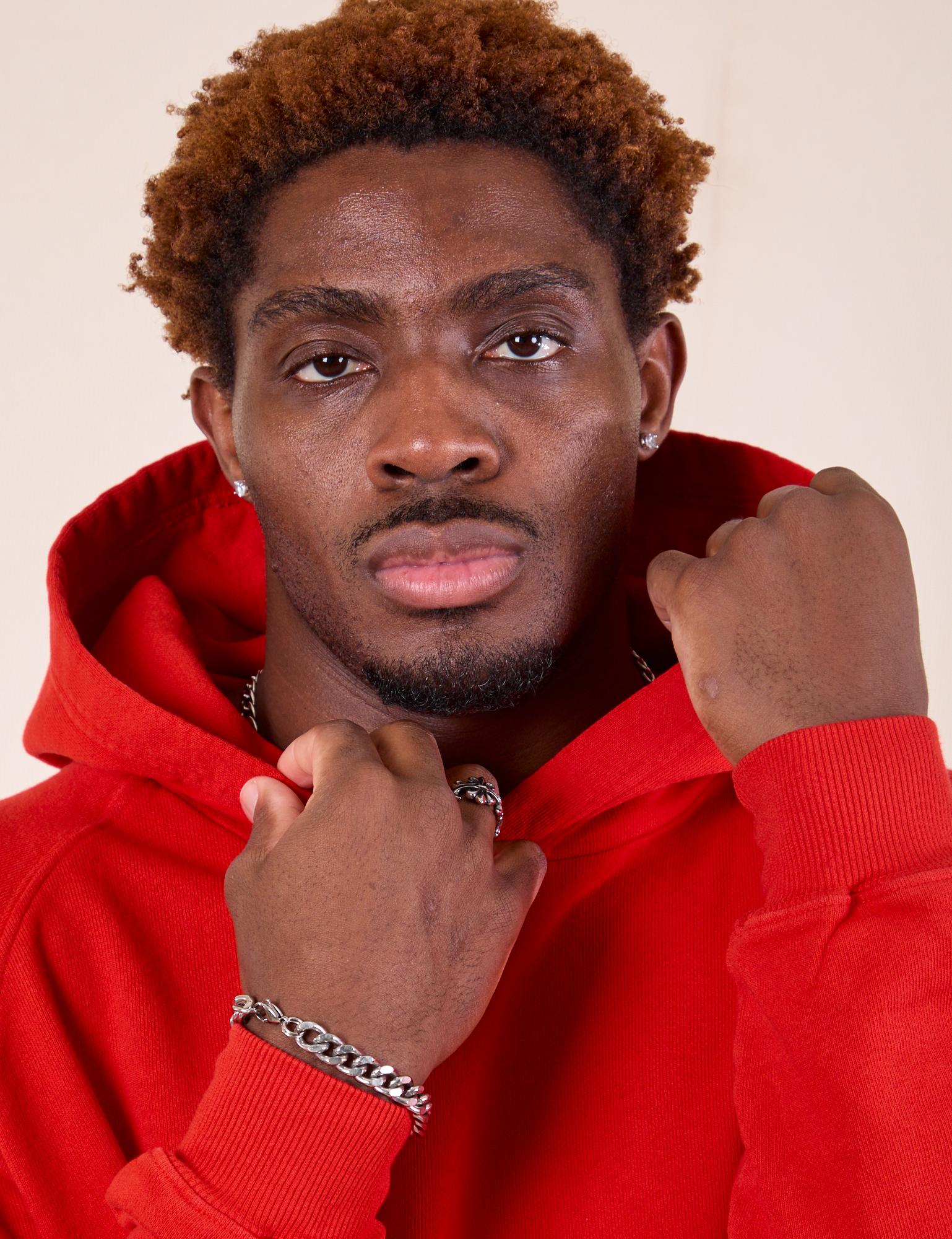 Oversized Hoodie in Mustang Red close up on Issac