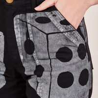 Front pocket close up of Icon Work Pants in Dice. Alex has their hand in the pocket.