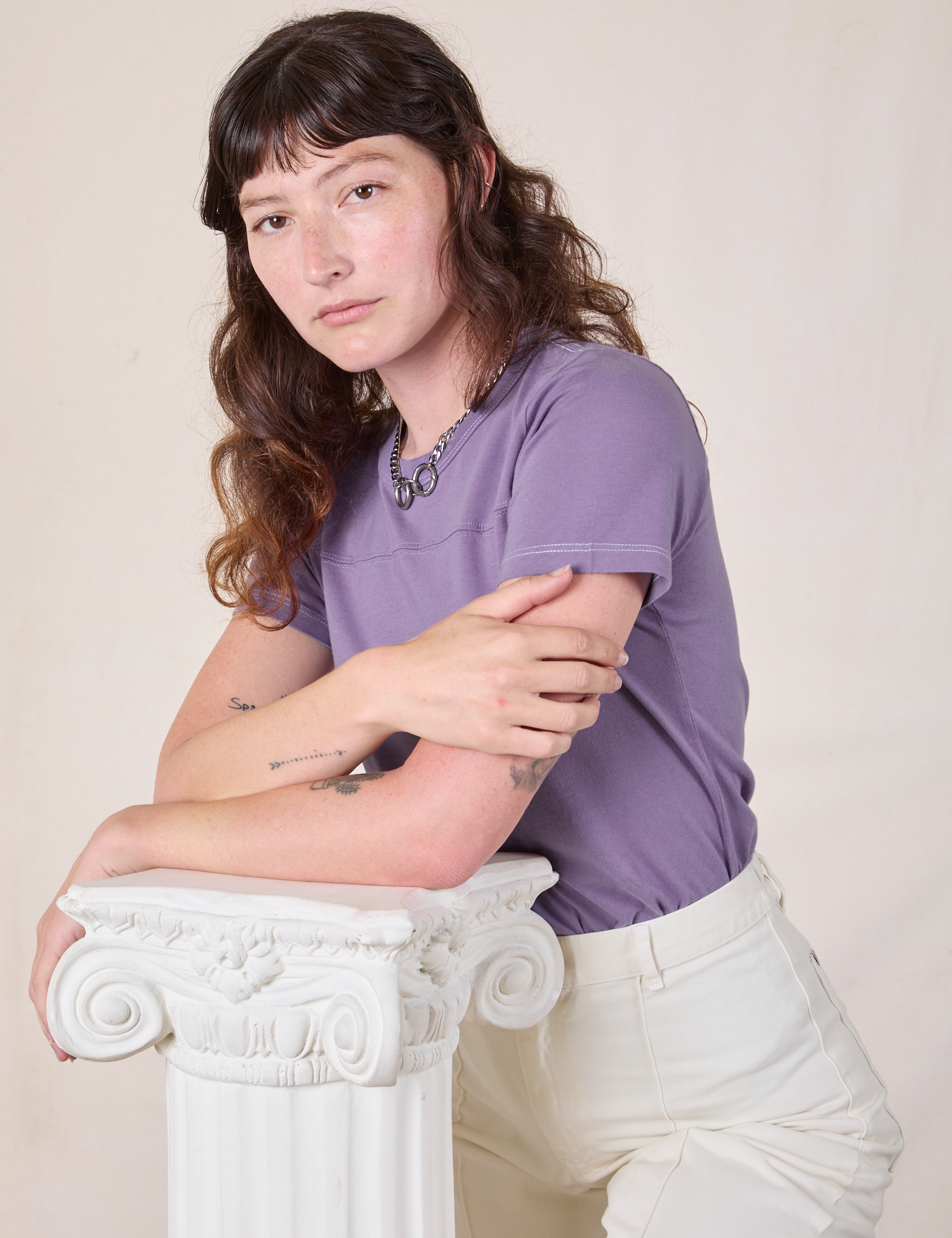 Alex is wearing Jr. Varsity Tee in Faded Grape