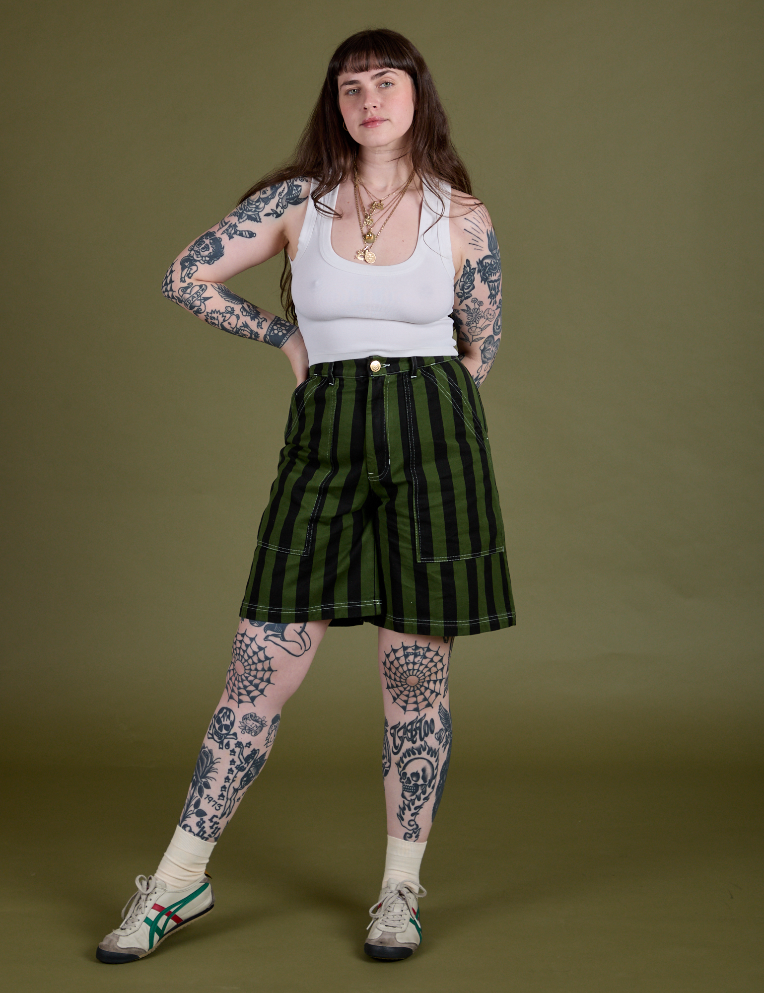 Sydney is 5’9” and wearing S Longline Work Shorts in Evergreen paired with vintage tee white Cropped Tank