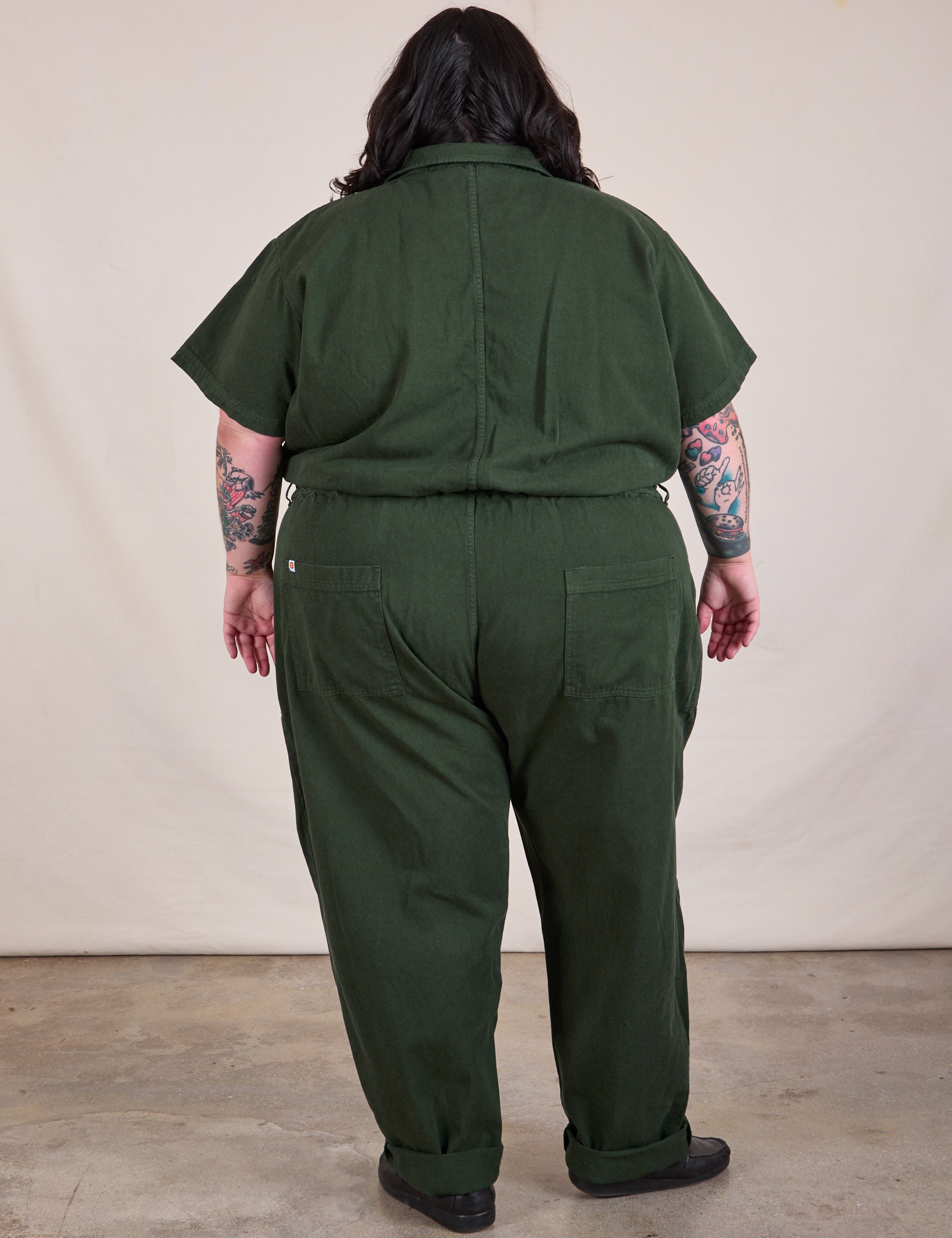 Back view of Long Jumpsuit in Swamp Green on Sam