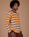 Long Sleeve Striped Burly Tee in Orange side view on Jerrod