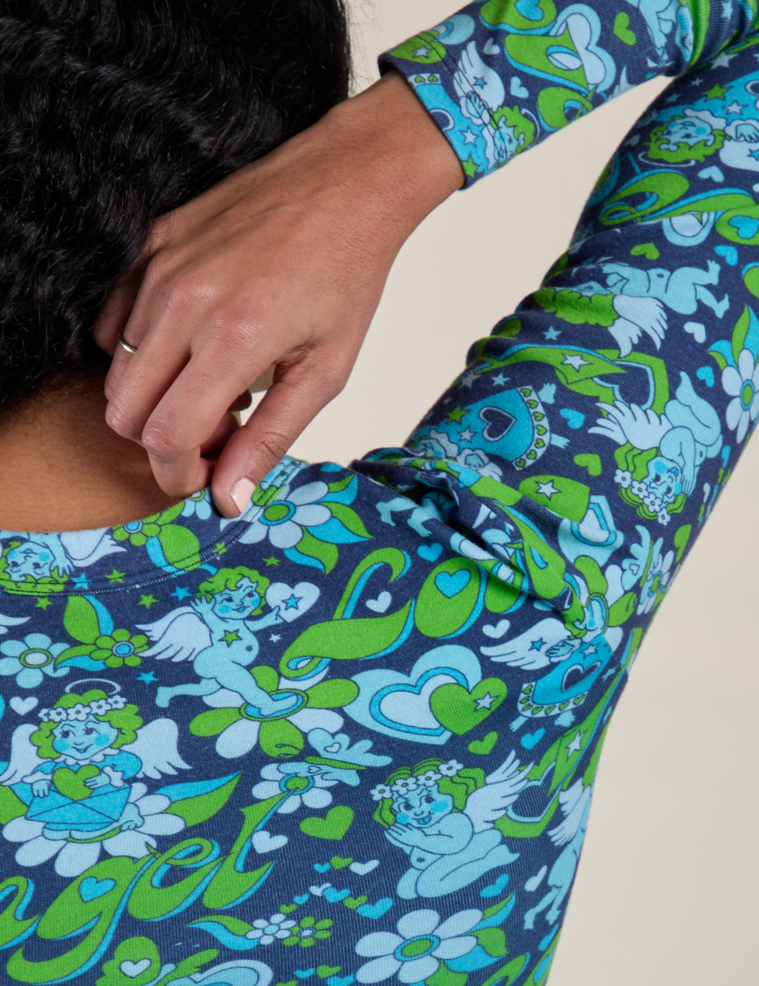 Back shoulder close up of Long Sleeve Baby Tee in Angel Print on Shahana