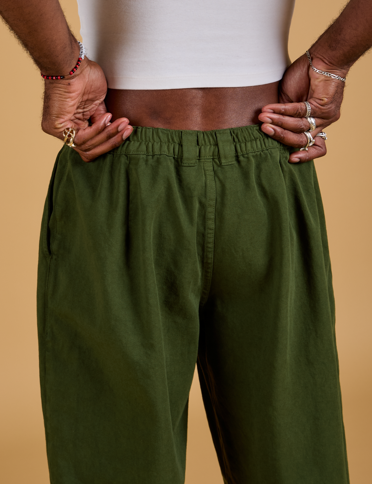 Baggy Mid-Rise Trousers in Evergreen back close up on Jerrod