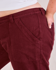 Mid-Rise Work Pants in Red Wine front pocket close up on Juliet