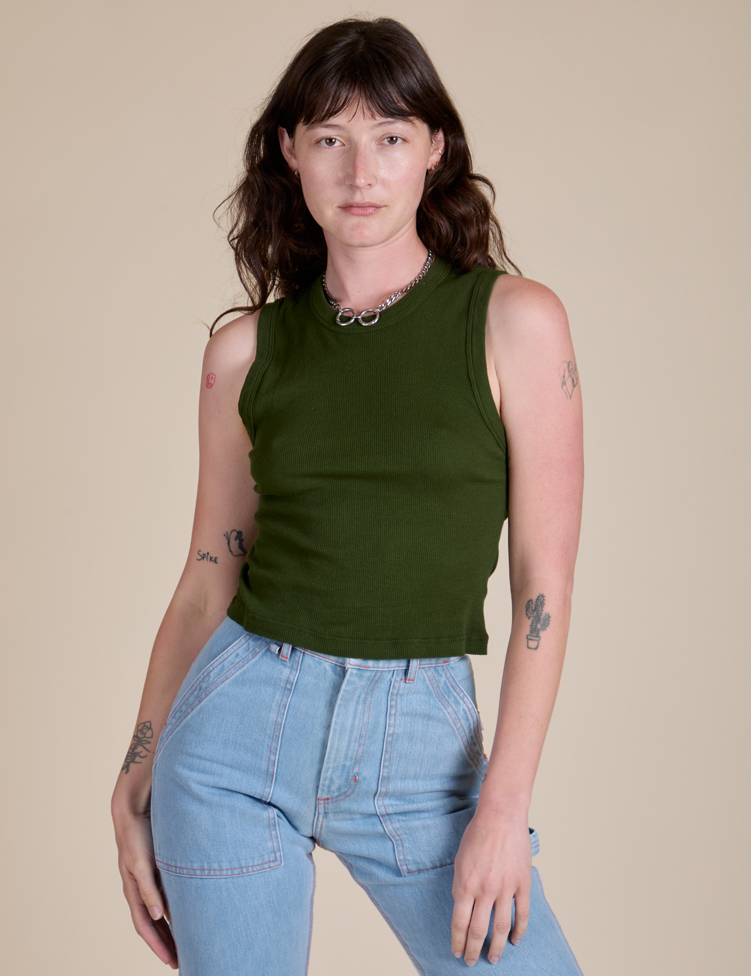 Alex is 5’8” and wearing P Muscle Tee in Evergreen