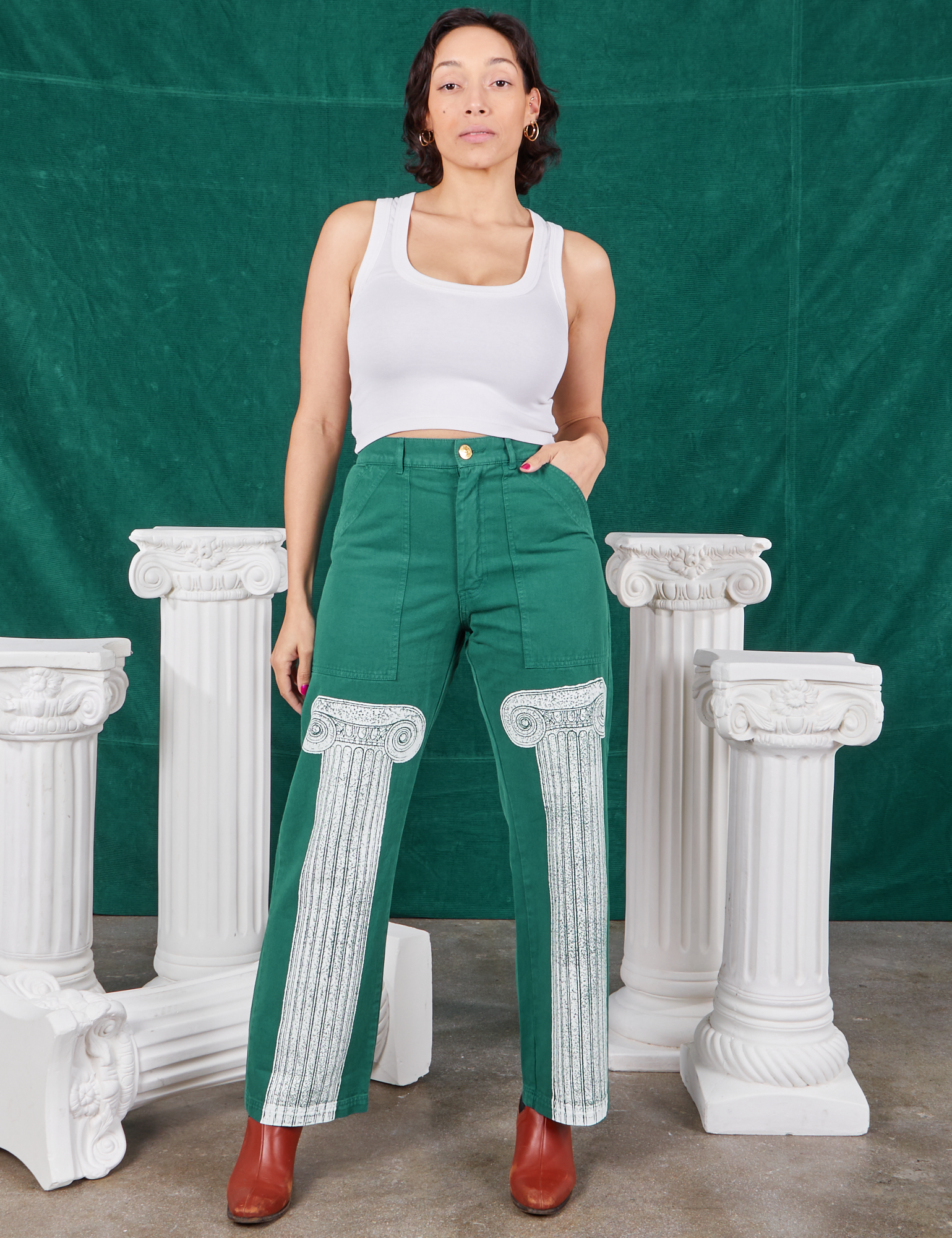 Tiara is 5&#39;4&quot; and wearing S Column Work Pants in Hunter Green paired with vintage off-white Cropped Tank Top