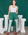 Tiara is 5'4" and wearing S Column Work Pants in Hunter Green paired with vintage off-white Cropped Tank Top