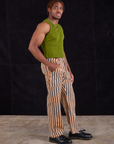 Side view of Work Pants in Autumn Stripe and summer olive Muscle Tee worn by Issac