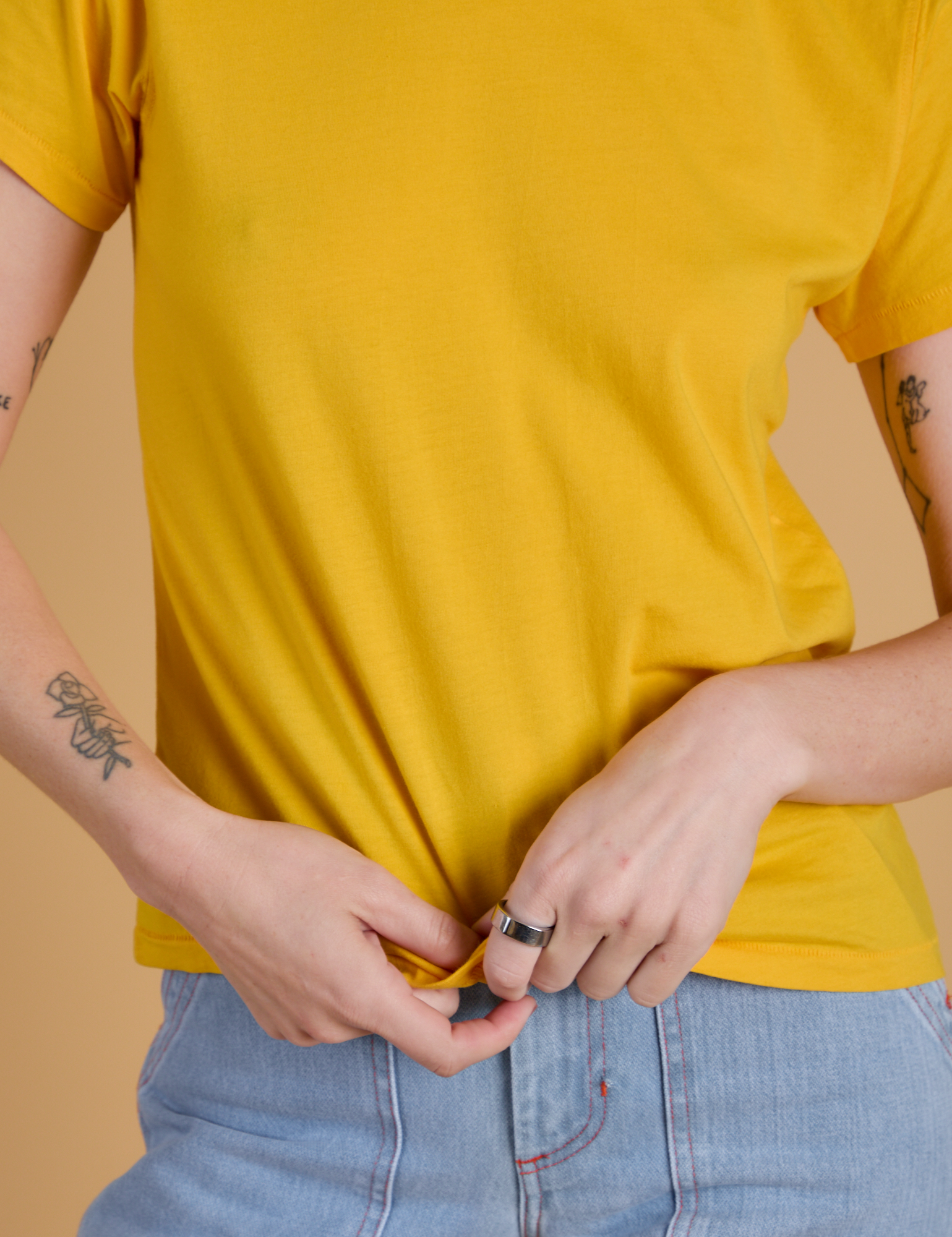 Organic Vintage Tee in Sunshine Yellow close up on Alex