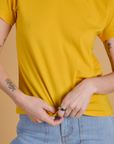 Organic Vintage Tee in Sunshine Yellow close up on Alex