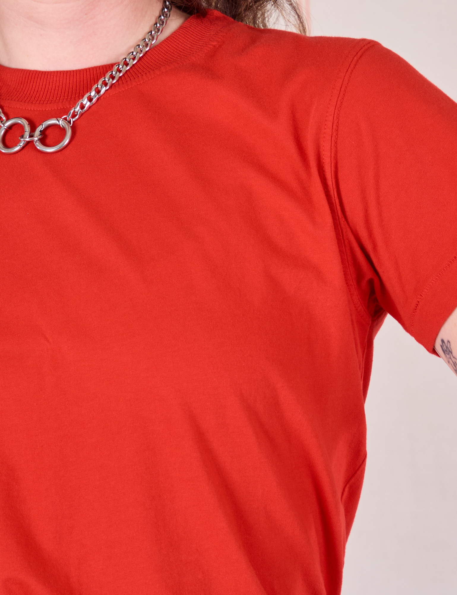 Front close up of Organic Vintage Tee in Mustang Red on Alex