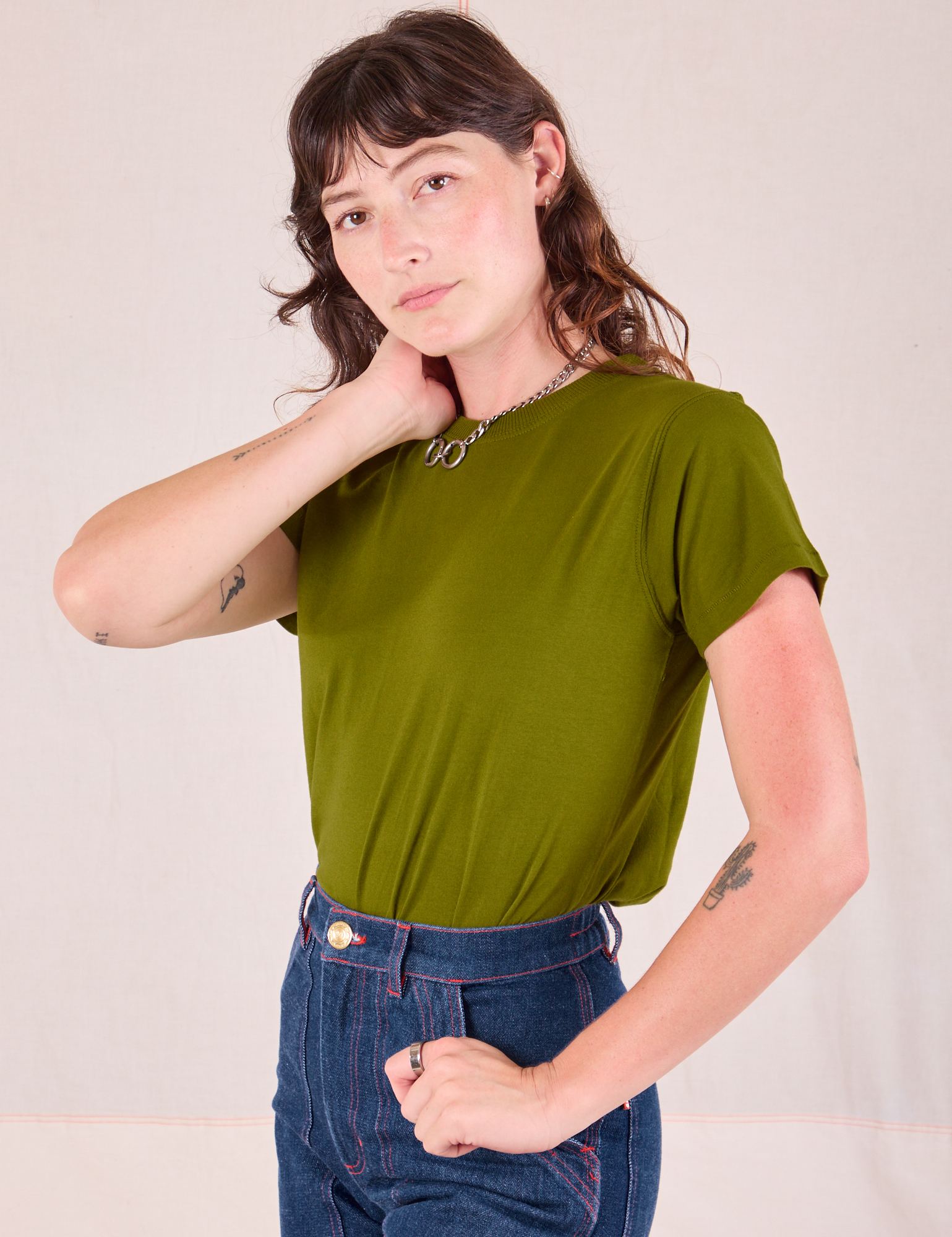 Organic Vintage Tee in Summer Olive angled front view on Alex