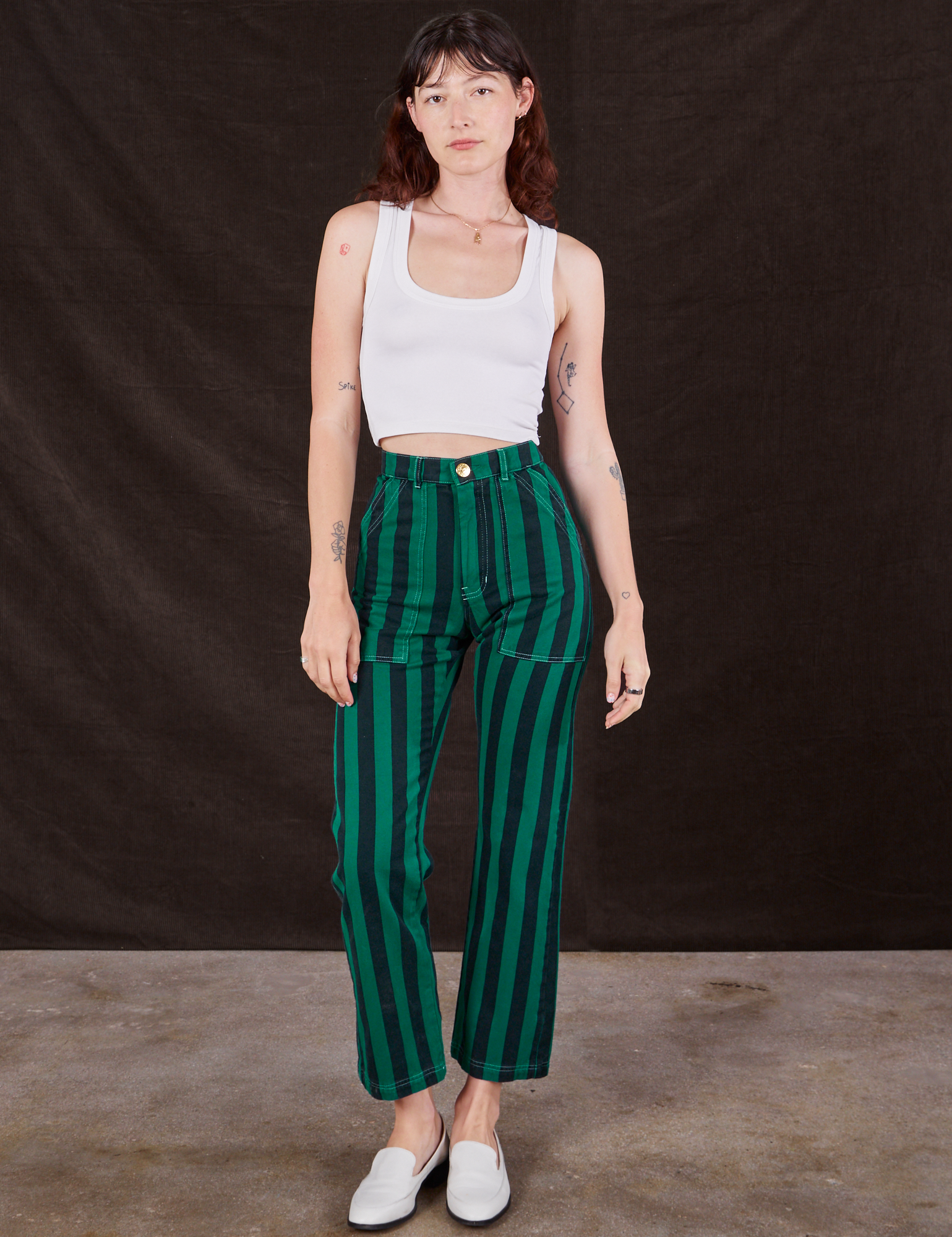 Alex is 5&#39;8&quot; and wearing XS Black Stripe Work Pants in Hunter paired with vintage off-white Cropped Tank Top