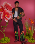 Jesse is wearing Paintstamped Pantry Button-Up in Poppy and matching Work Pants