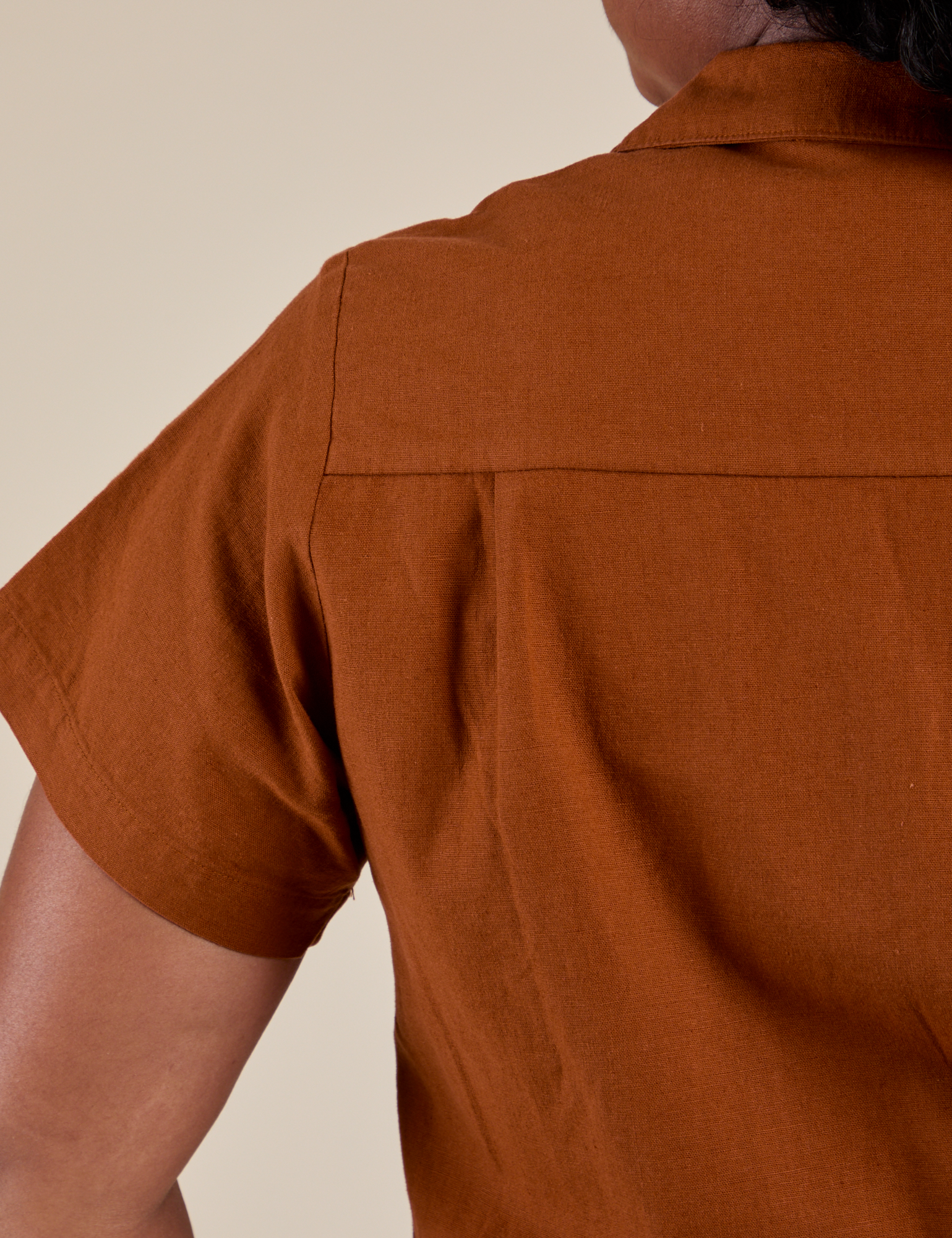 Back shoulder close up of Pantry Button-Up in Burnt Terracotta on Meghna