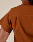 Back shoulder close up of Pantry Button-Up in Burnt Terracotta on Meghna