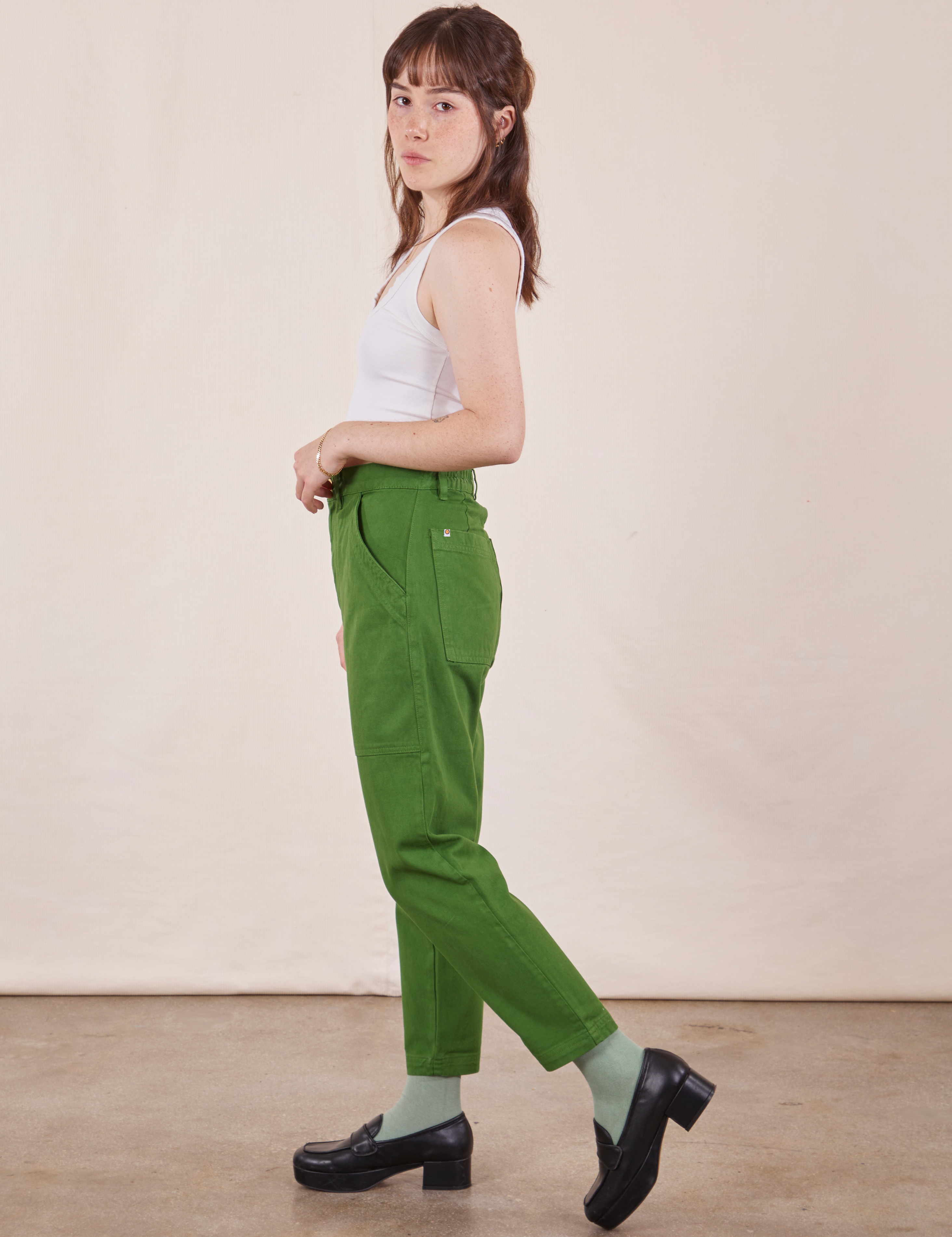 Side view of Petite Pencil Pants in Lawn Green on Hana