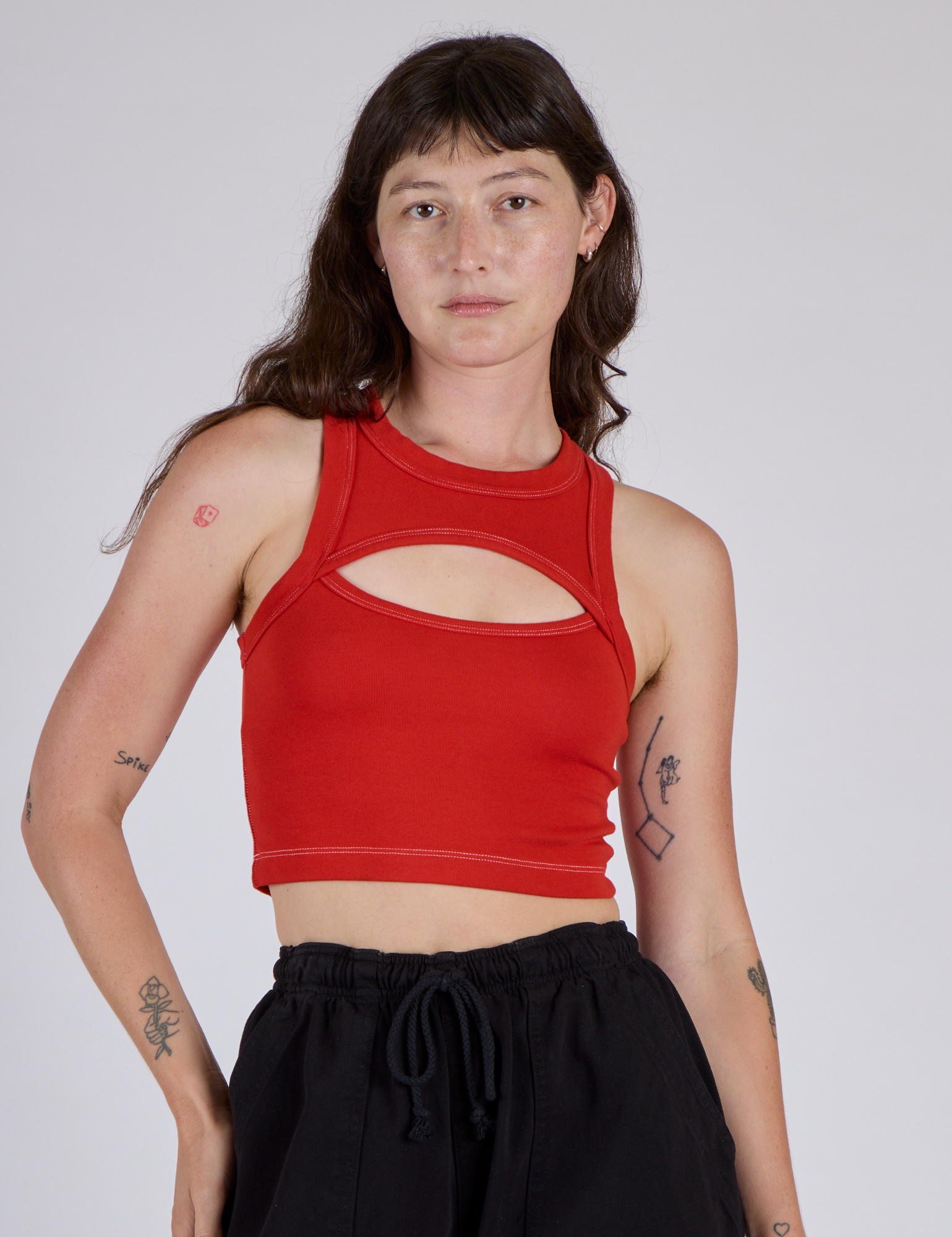 Alex is 5’8” and wearing P Porthole Tank in Mustang Red