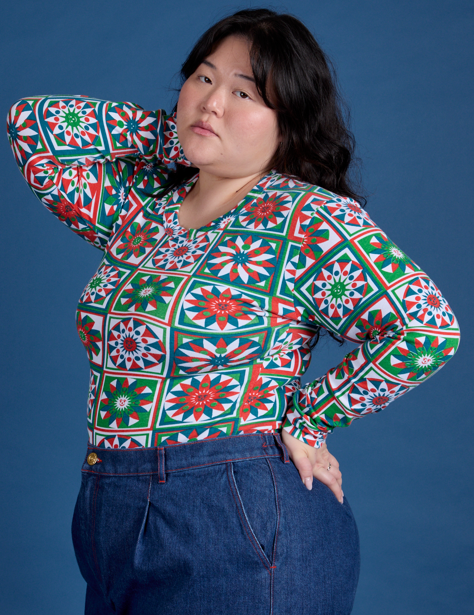 Angled front view of Long Sleeve Baby Tee in Quilt Print on Ashley