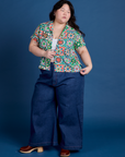 Ashley is wearing Quilt Print Pantry Button-Up and dark wash Indigo Wide Leg Trousers