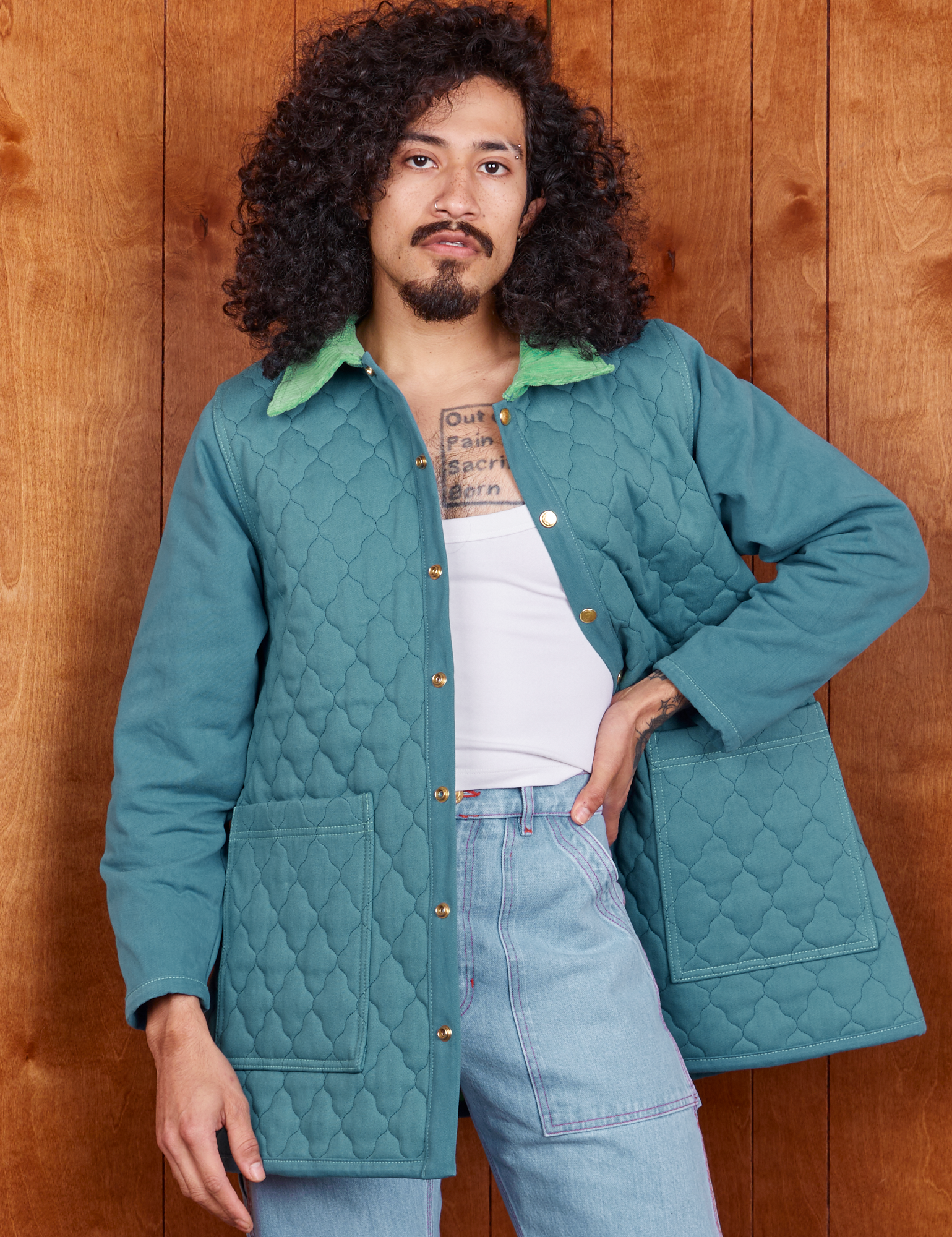 Jesse is wearing Quilted Overcoat in Marine Blue