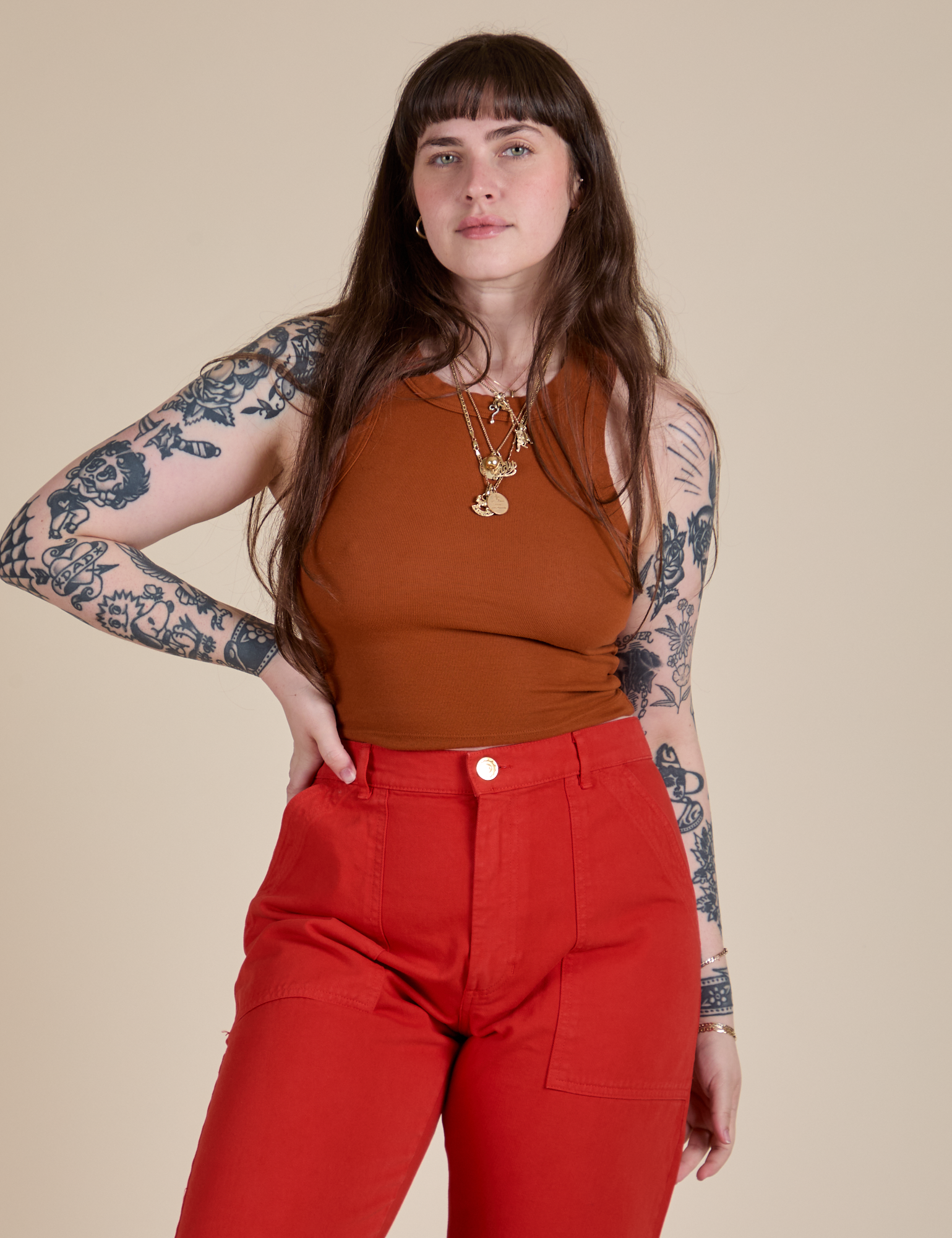 Sydney is 5’9” and wearing XXS Racerback Tank in Burnt Terracotta