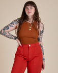 Sydney is 5’9” and wearing XXS Racerback Tank in Burnt Terracotta