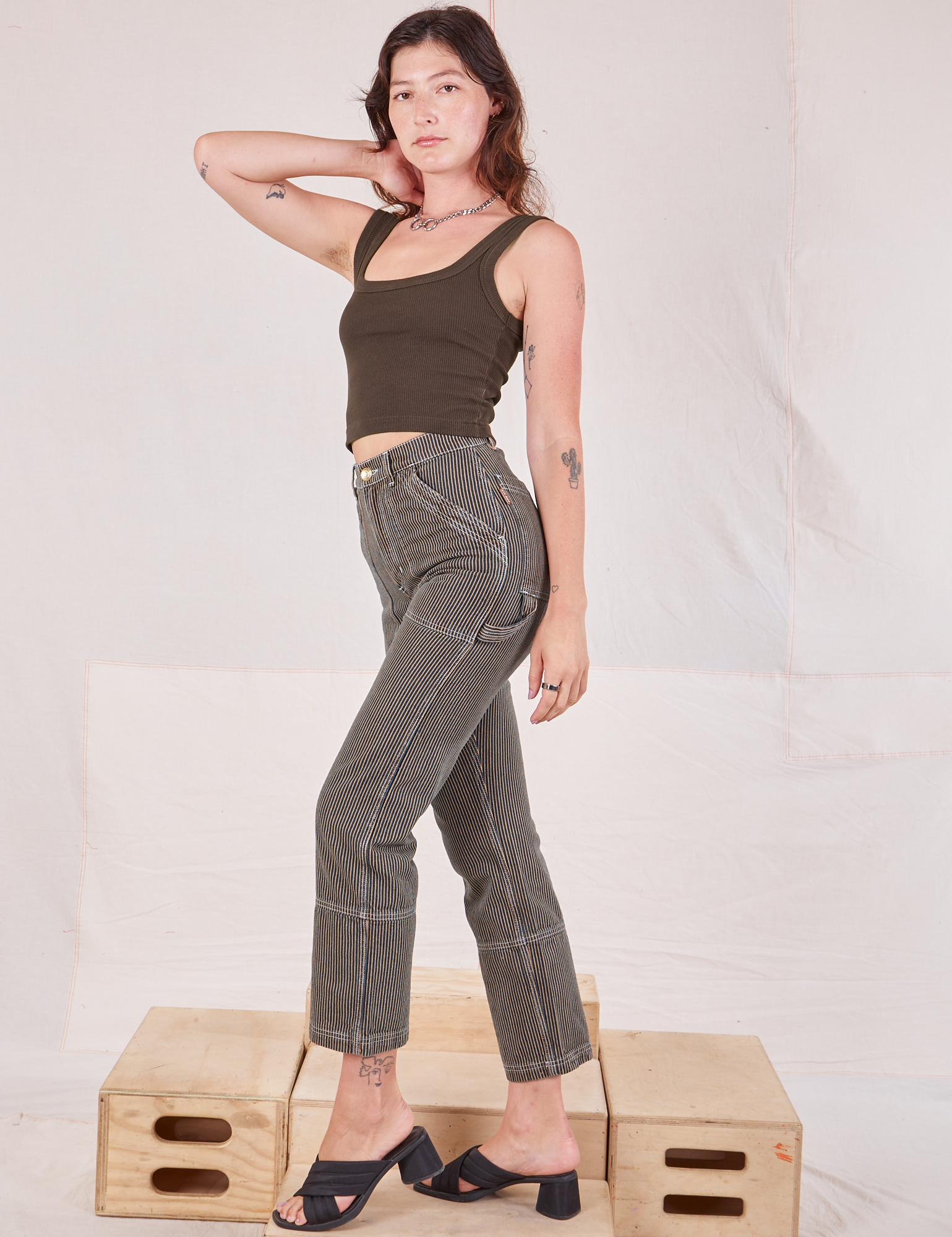 Side view of Railroad Carpenter Jeans in Vintage Tan and espresso brown Square Neck Tank on Alex