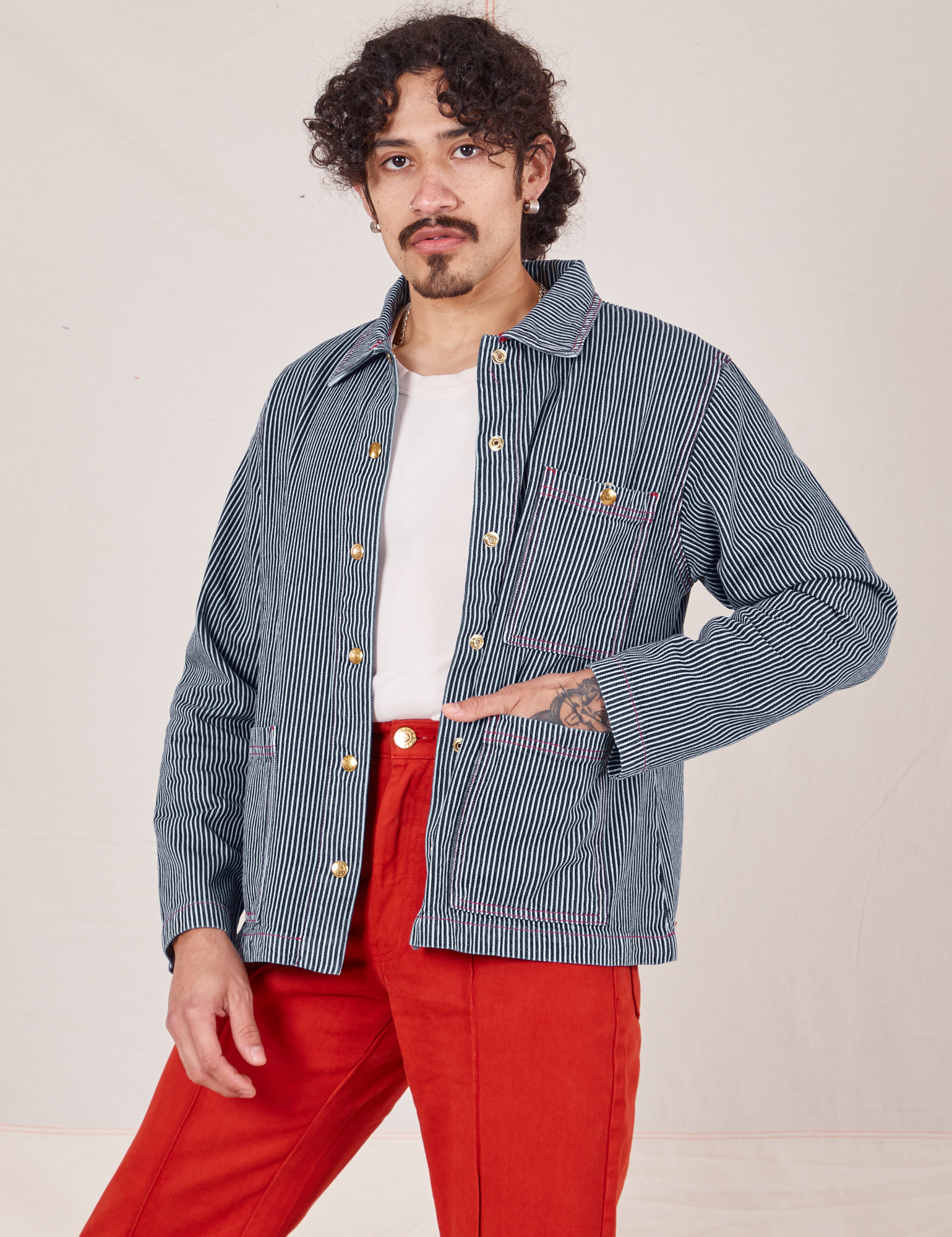 Jesse is 5&#39;8&quot; and wearing S Railroad Stripe Denim Work Jacket paired with paprika Western Pants