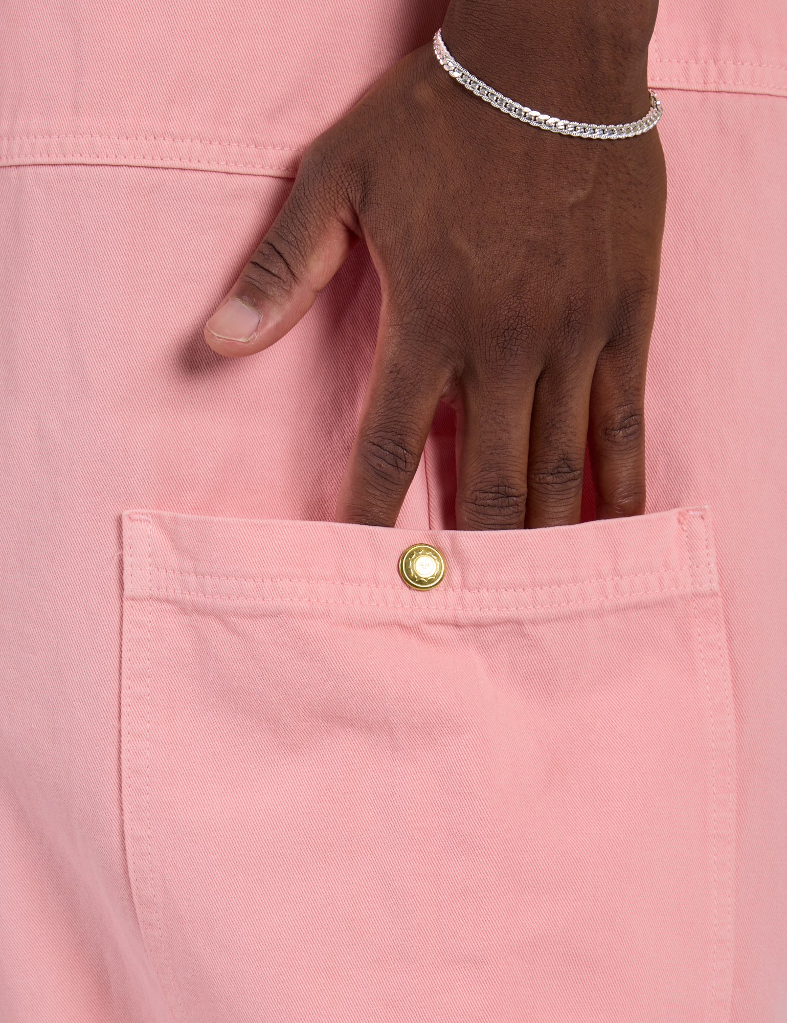 Close up of Isaac's hand in the side pocket of Drop Pocket Cargo Pants in Baby Pink