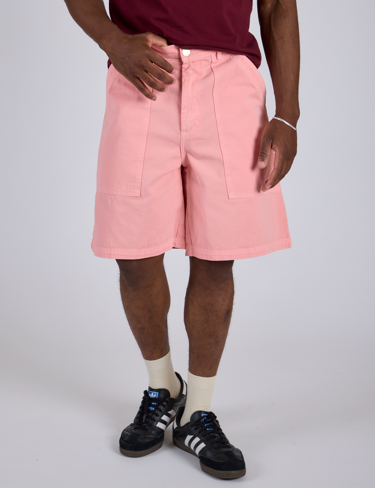Close up of Longline Work Shorts in Baby Pink on Isaac