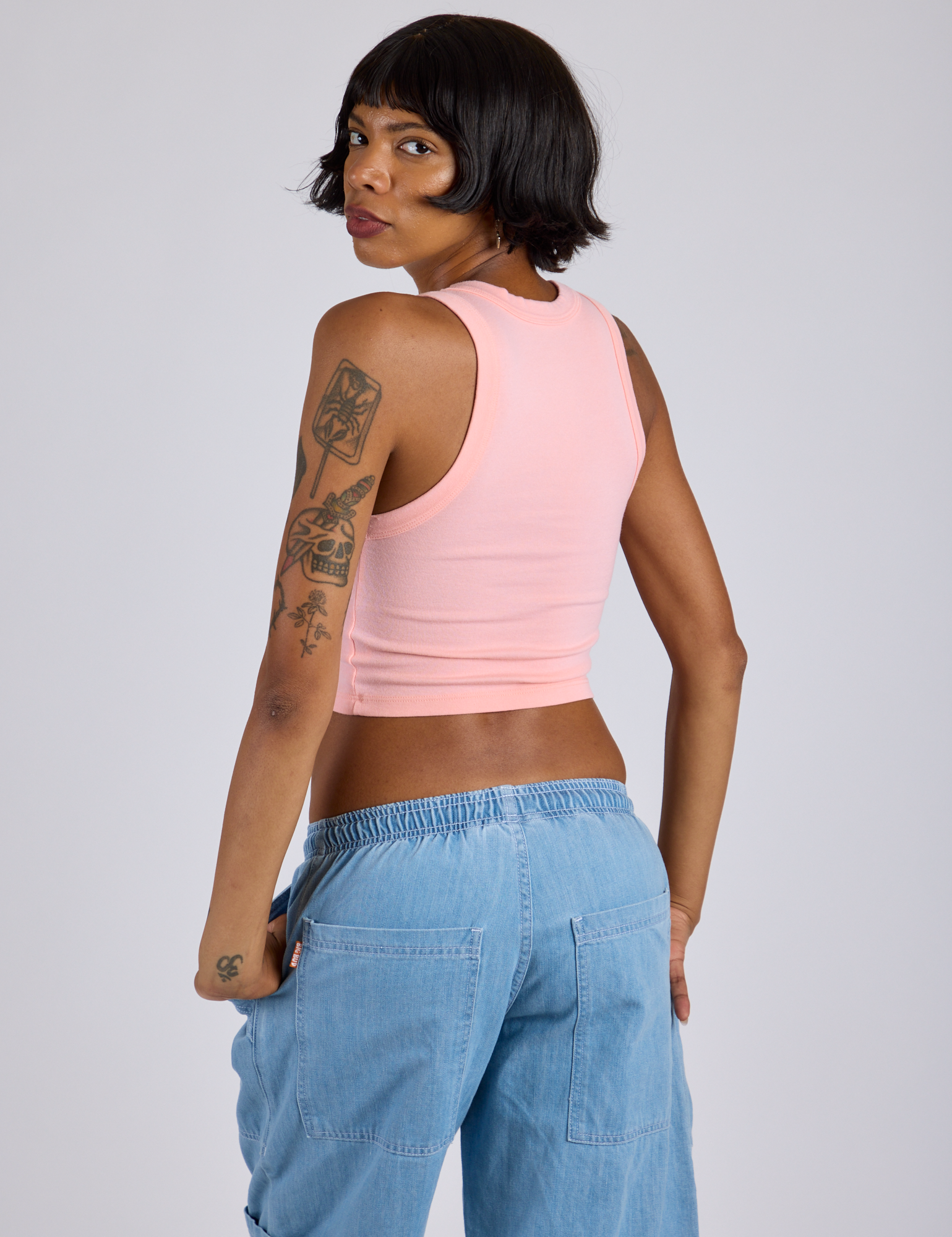 Cropped Tank Top in Baby Pink angled back view on Kira