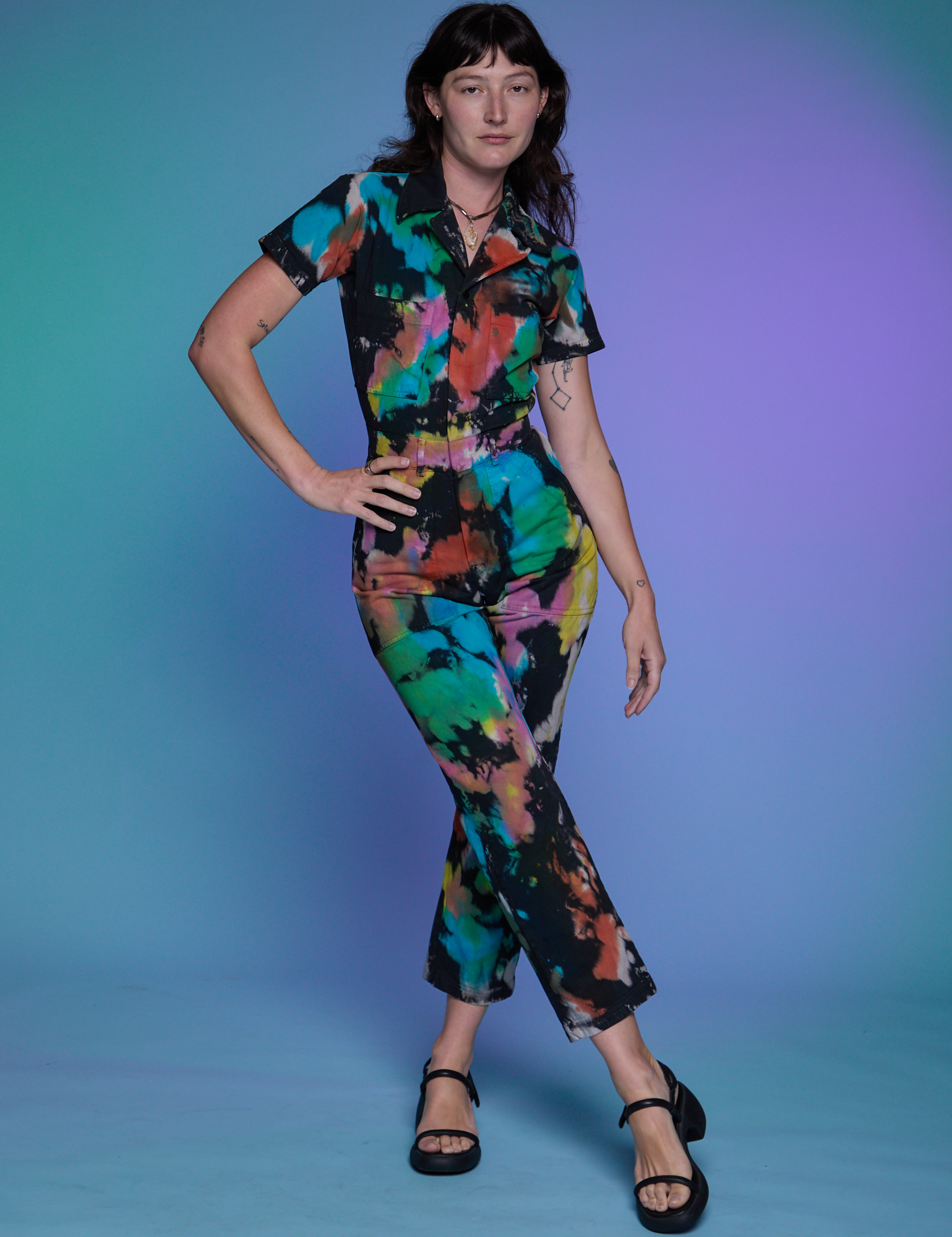 Short Sleeve Jumpsuit in Rainbow Magic Waters worn by Alex