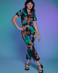 Short Sleeve Jumpsuit in Rainbow Magic Waters worn by Alex