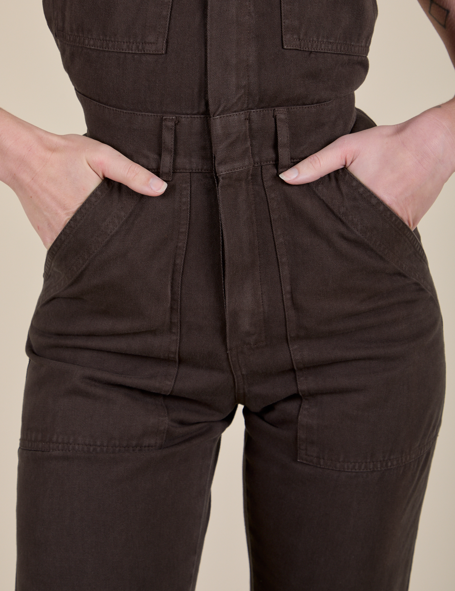 Short Sleeve Jumpsuit in Espresso Brown front close up on Alex