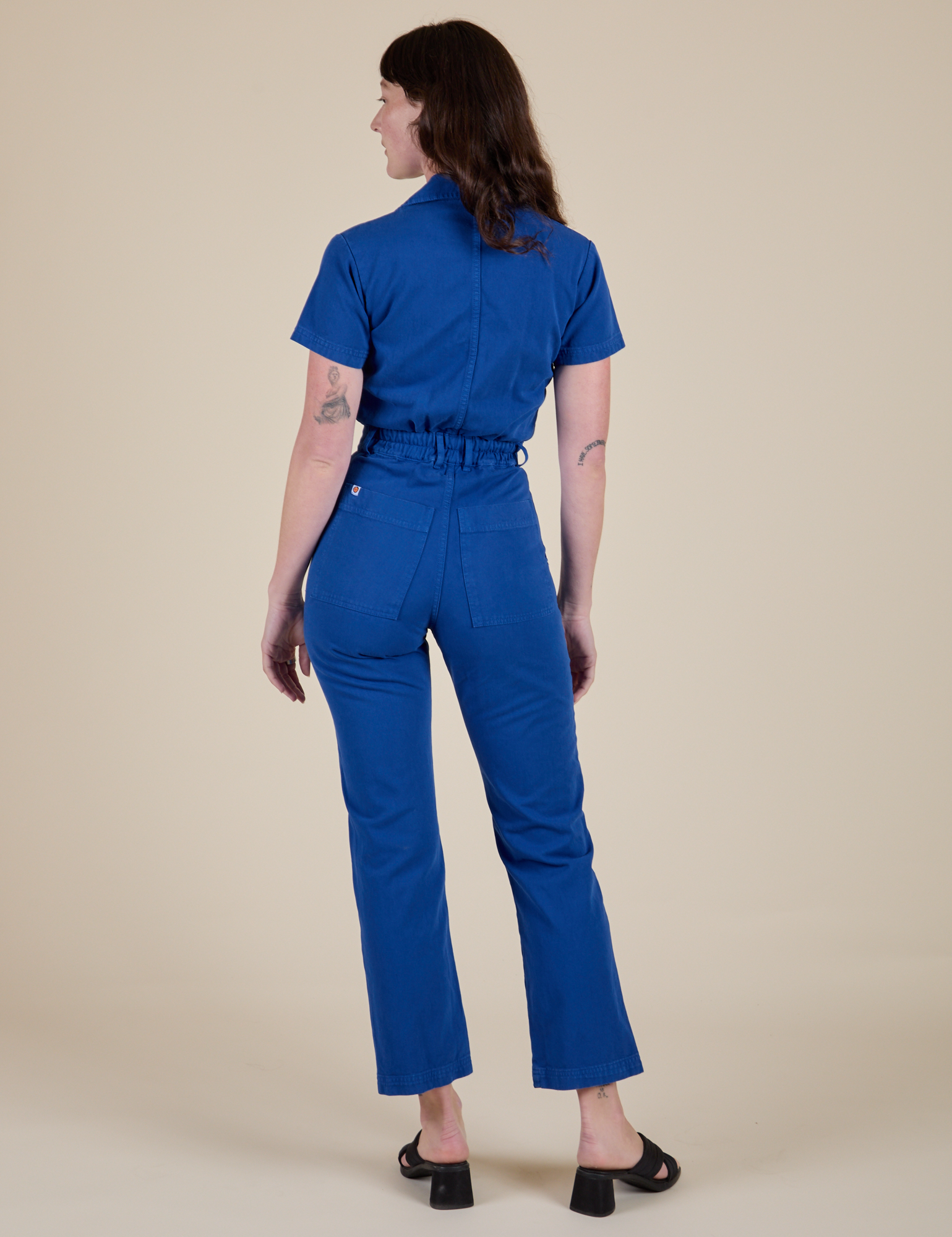 Short Sleeve Jumpsuit in Royal Blue back view on Alex