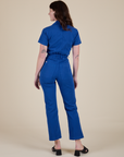 Short Sleeve Jumpsuit in Royal Blue back view on Alex