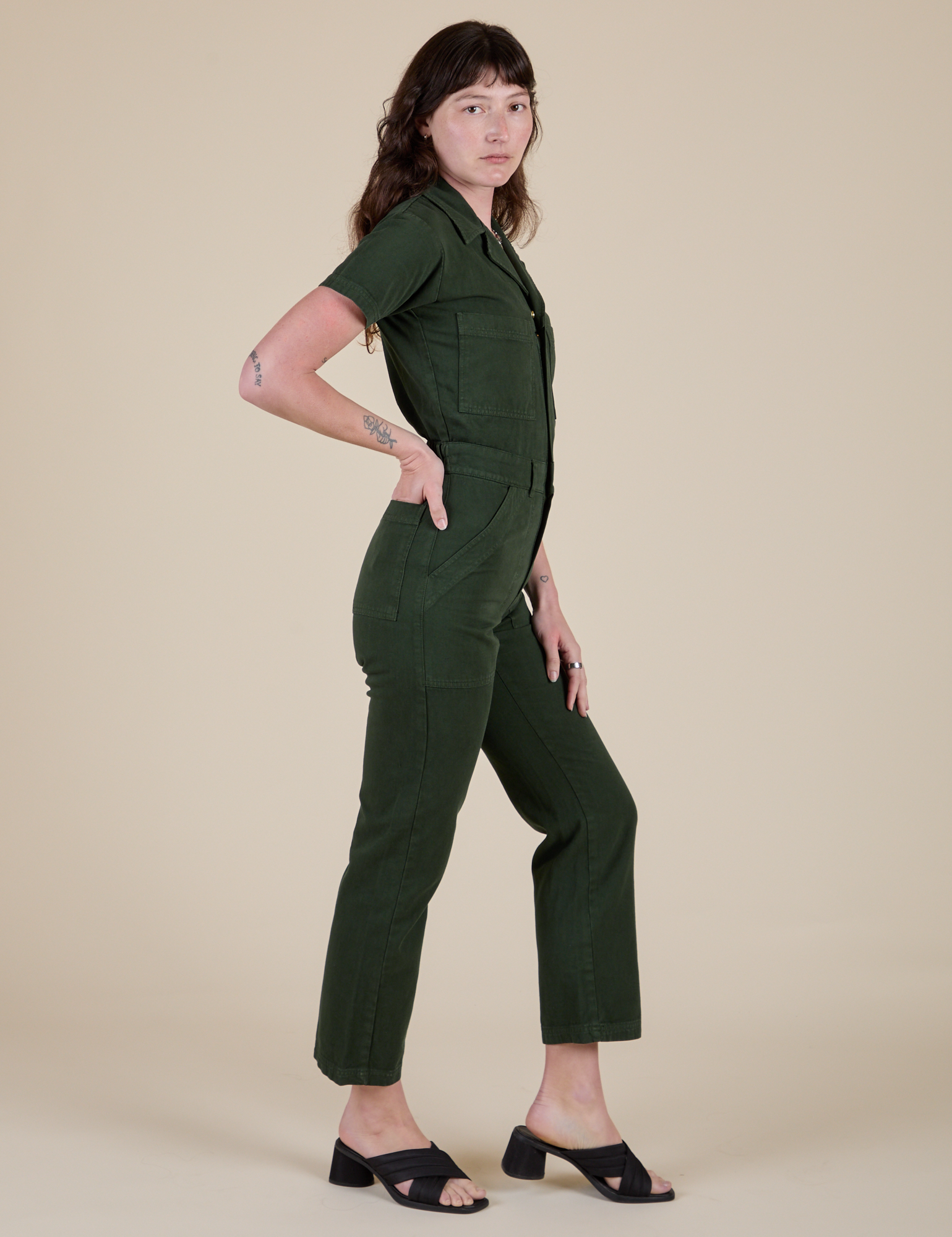 Side view of Short Sleeve Jumpsuit in Swamp Green on Alex