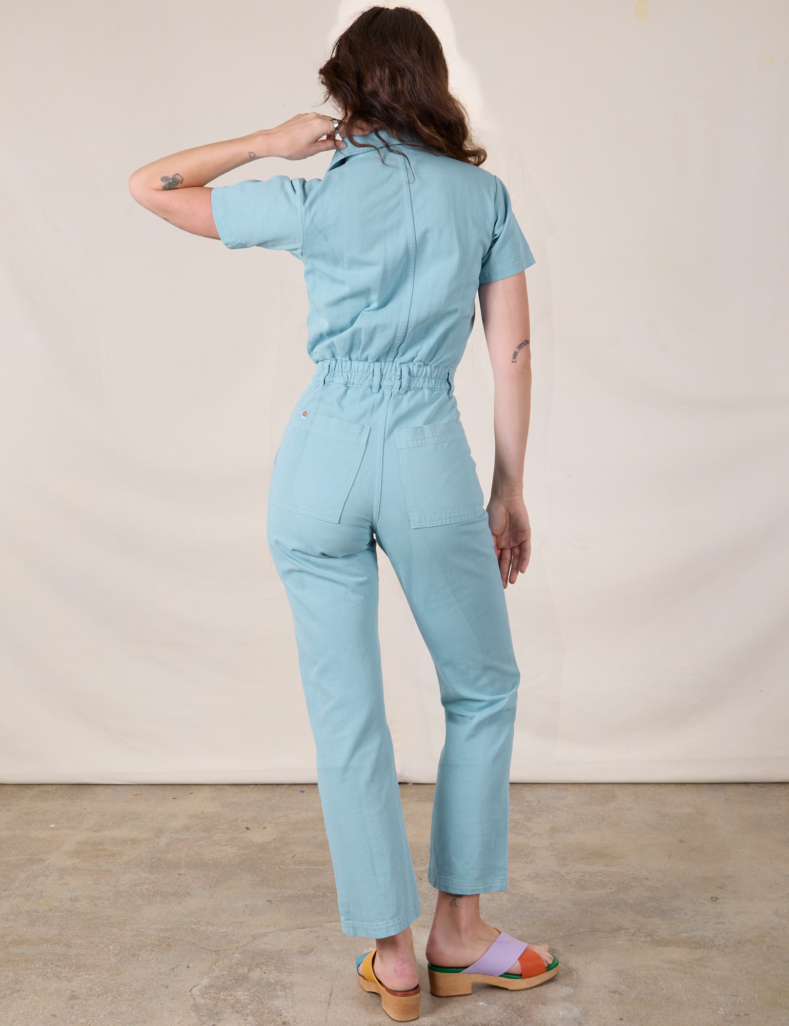 Short Sleeve Jumpsuit in Baby Blue back view on Alex