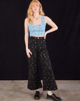 Margaret is wearing Star Cropped Tank and Star Bell Bottoms in black