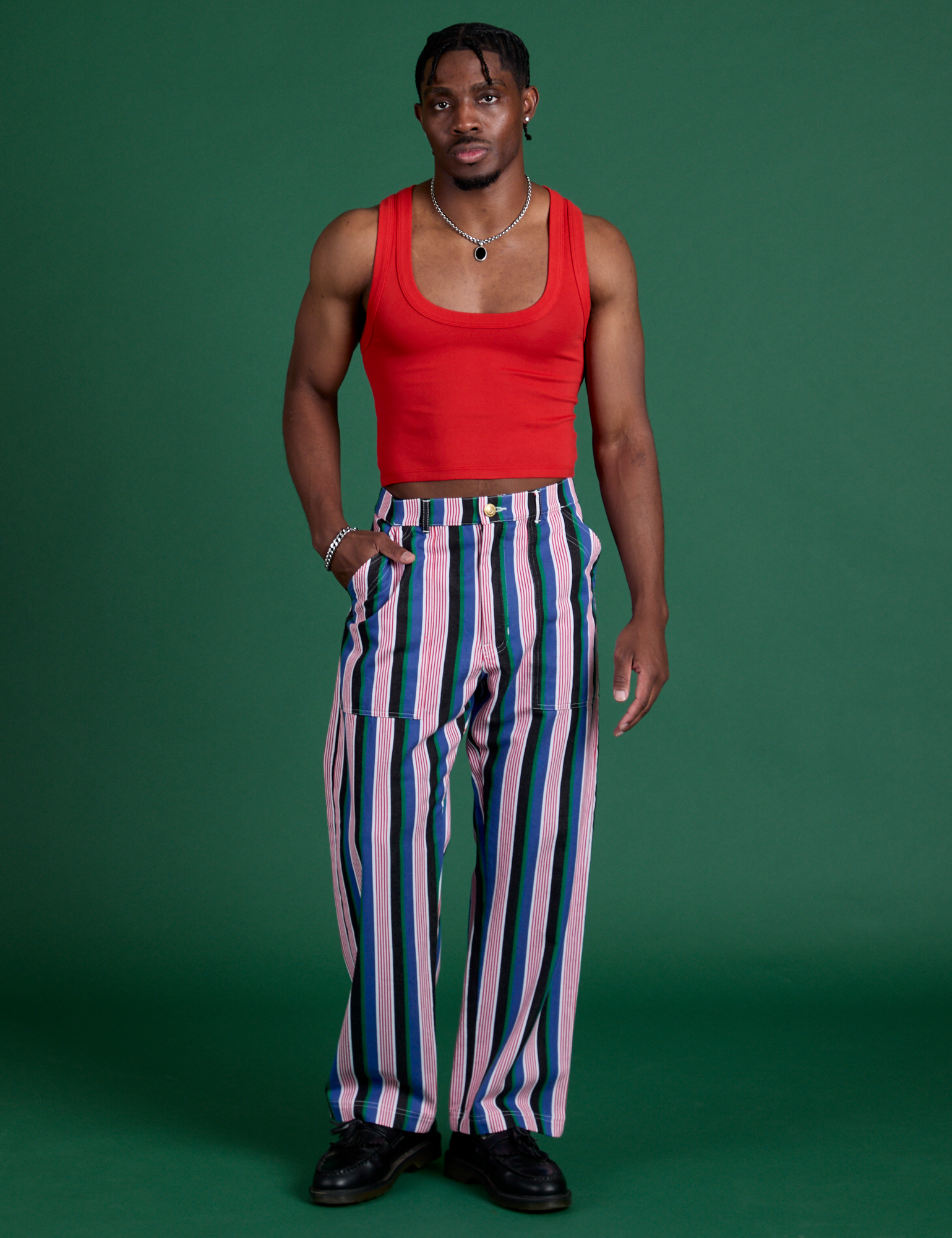 Isaac is 5’10” and wearing M Work Pants in Pacific Stripe paired with mustang red Cropped Tank