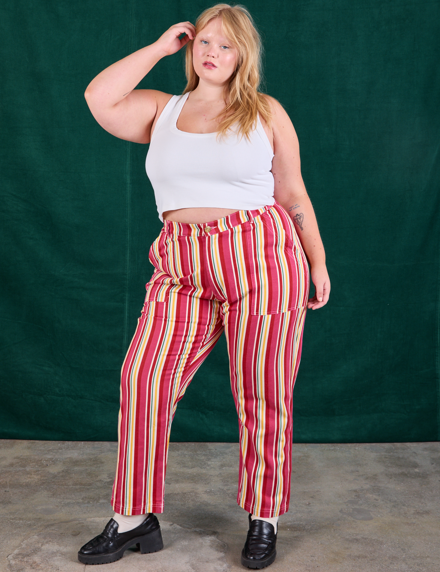 Juliet is 5&#39;7&quot; and wearing 1XL Stripe Work Pants in Cherry Candy paired with Cropped Tank in vintage tee off-white