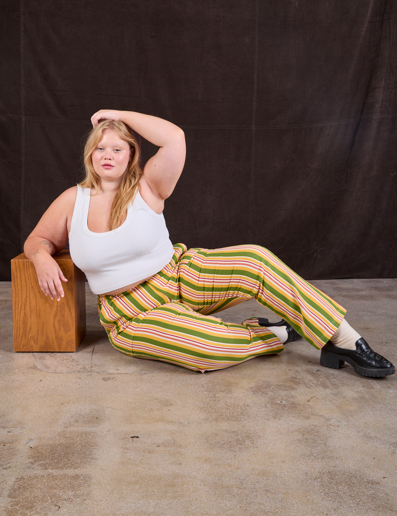 Juliet is wearing Stripe Work Pants in Vintage Sofa and Cropped Tank in vintage tee off-white