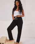 Kandia is 5'3" and wearing P Rolled Cuff Sweat Pants in Basic Black paired with a vintage off-white Cropped Tank
