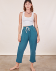 Alex is 5'8" and wearing XXS Cropped Rolled Cuff Sweatpants in Marine Blue