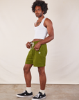 Side view of Lightweight Sweat Shorts in Summer Olive and Cropped Tank in vintage tee off-white on Jerrod